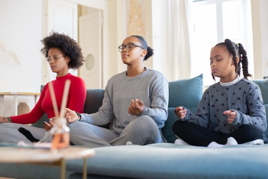 3 Individuals sitting on couch meditating